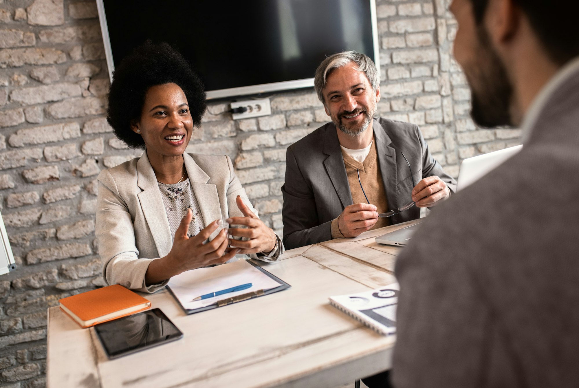 Business recruiters talking with candidate during job interview.